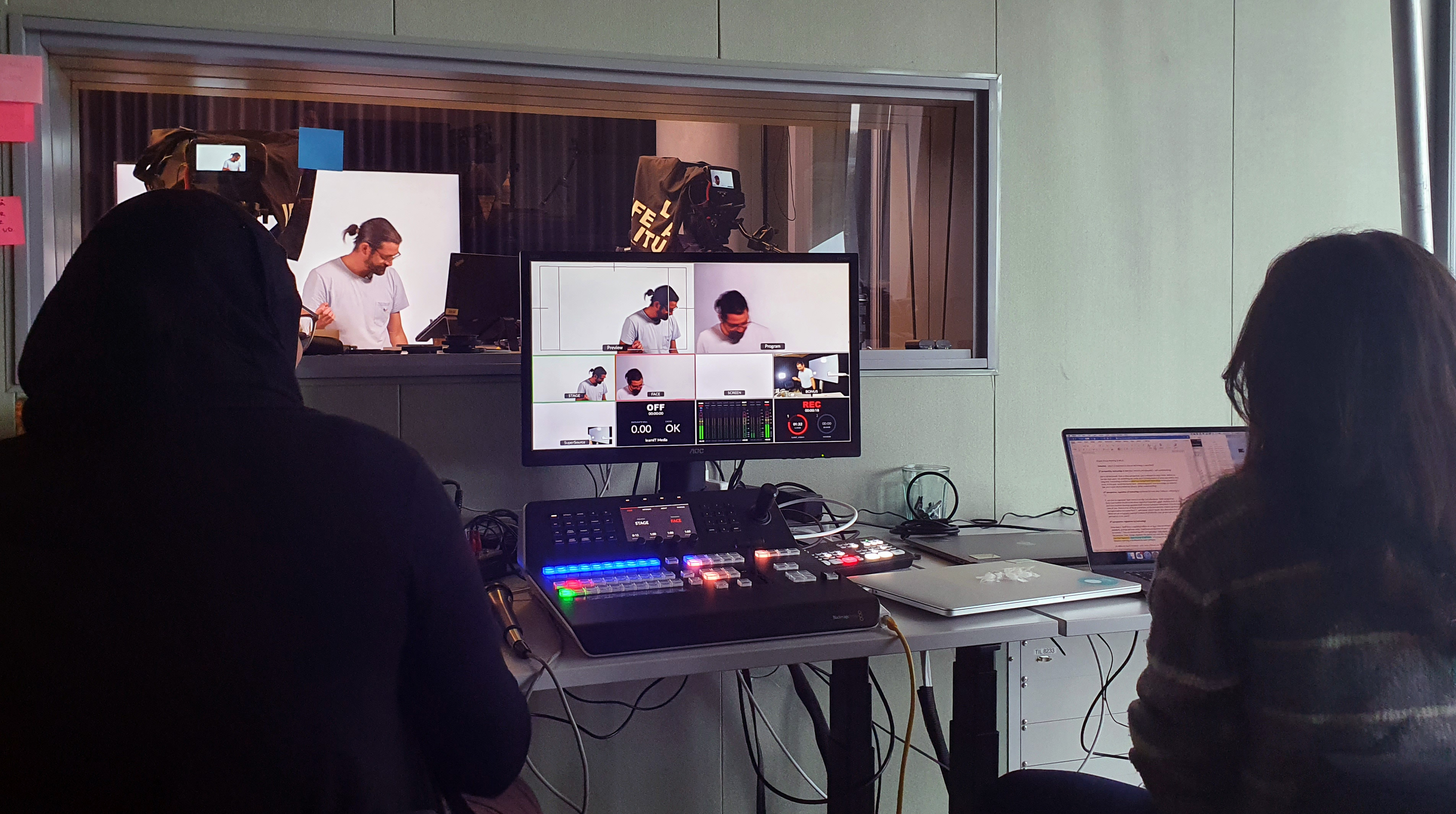 photo of video recording studio with 3 people